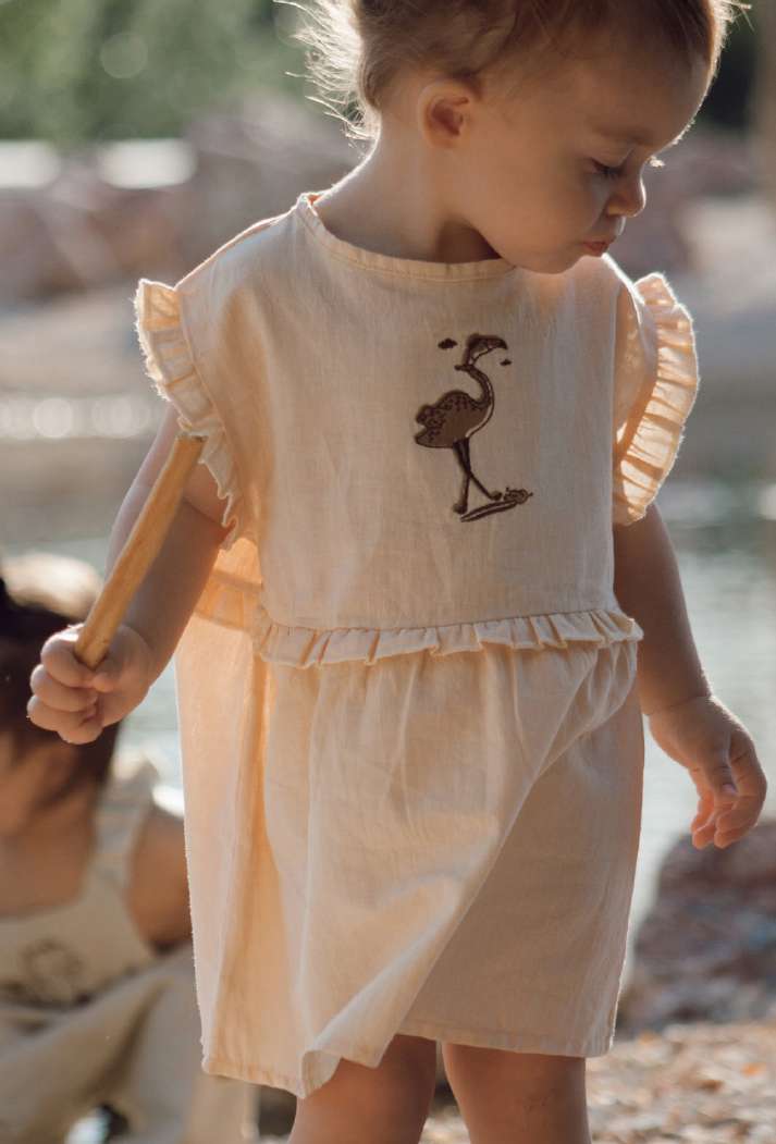 IVORY CREAM ‘FLAMINGO SURFING’ DRESS