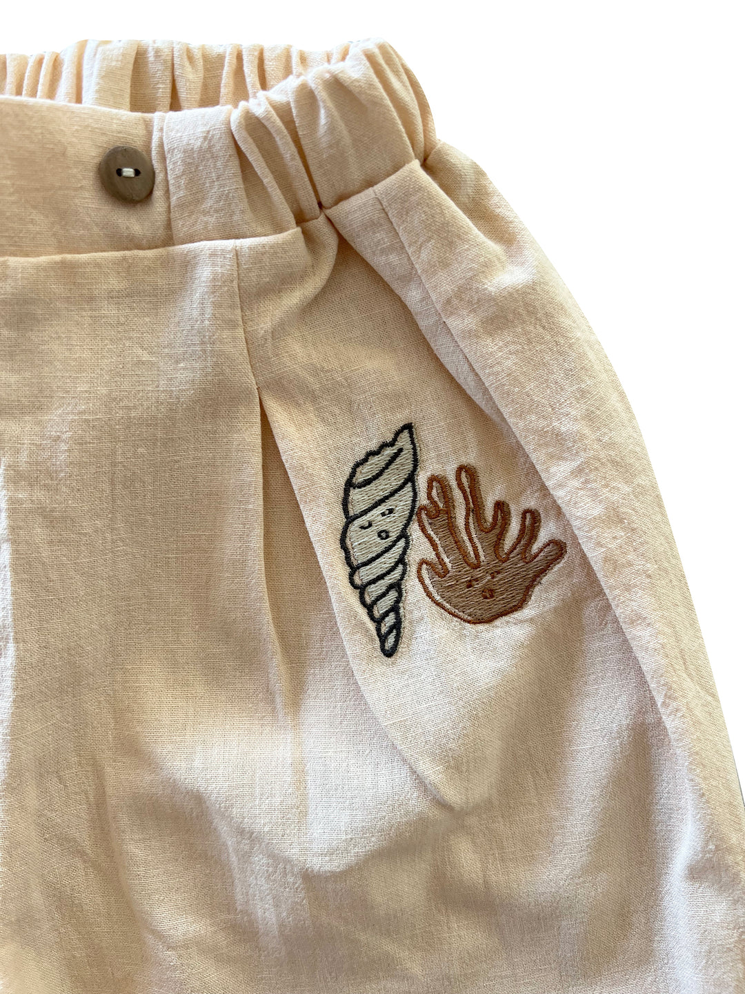 IVORY CREAM ’SHELL AND CORAL’ PLEATED WOVEN TROUSERS