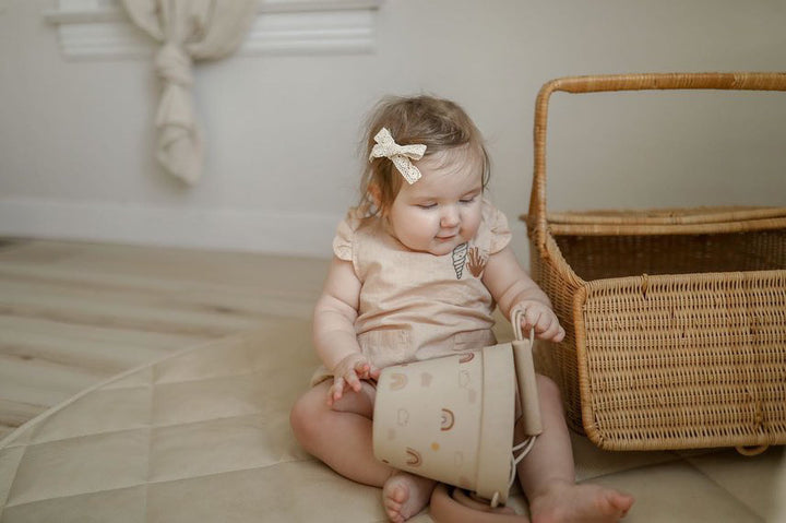 IVORY CREAM ’SHELL AND CORAL’ PLEATED WOVEN ROMPER