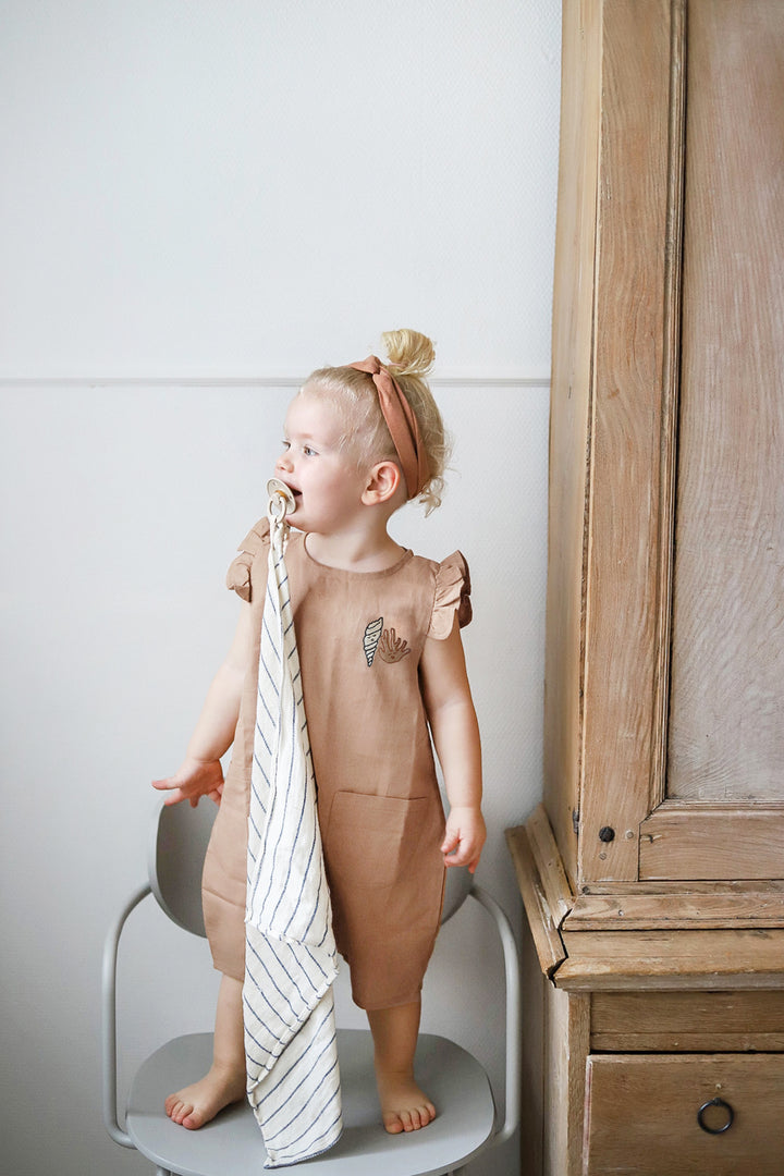 IVORY CREAM ’SHELL AND CORAL’ PLEATED WOVEN ROMPER